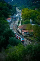 An FGC class 112 train leaving Les Planes station, heading towards Terrassa. There's an FCC class 400 "frog" on the background.